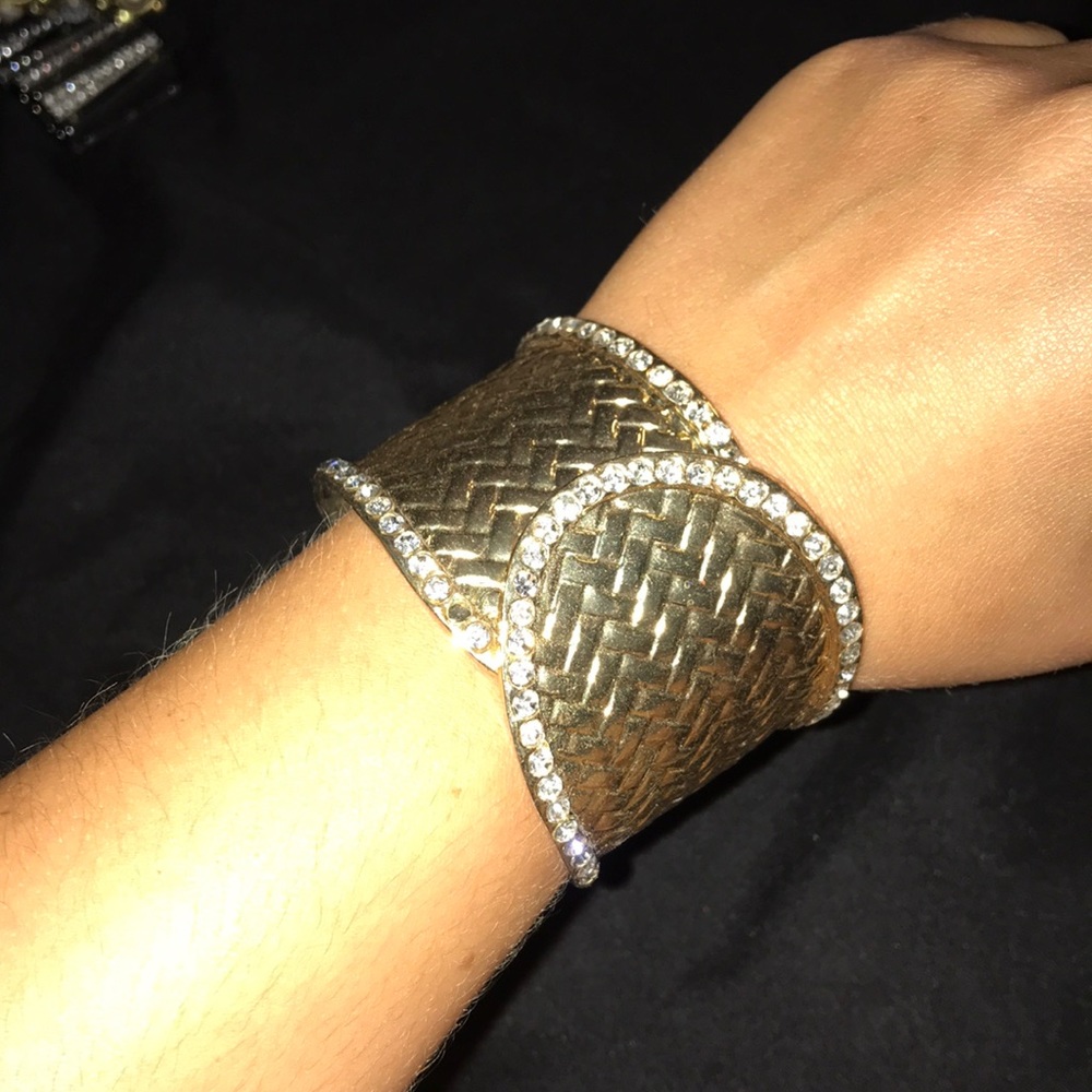 Gold cuff bracelet with diamonds lining the edges